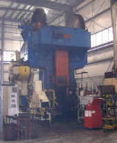 2500 ton FICEP screw press used for forging aluminum billets teated in Maestri chain-type oven